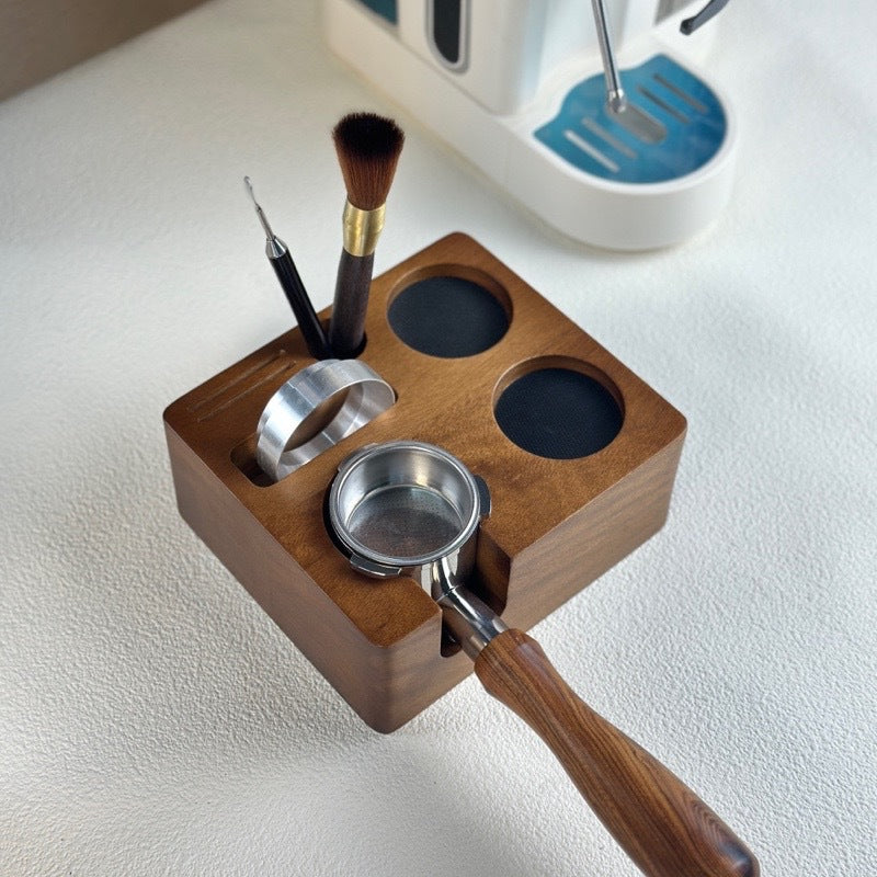 58mm solid wood espresso tamping station holding a portafilter during use