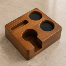 Close detail of the solid wood 58 mm espresso tamping station